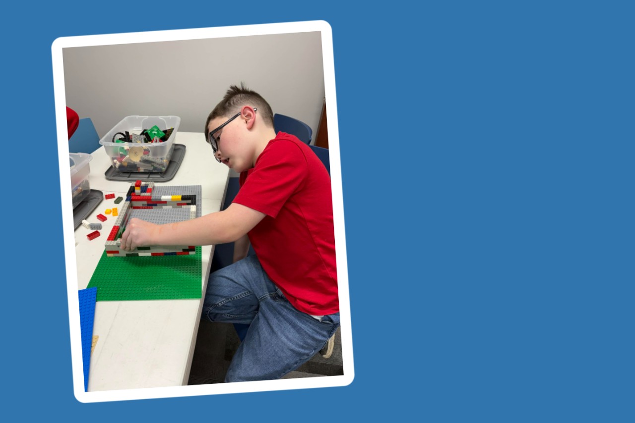 Boy building with Legos 